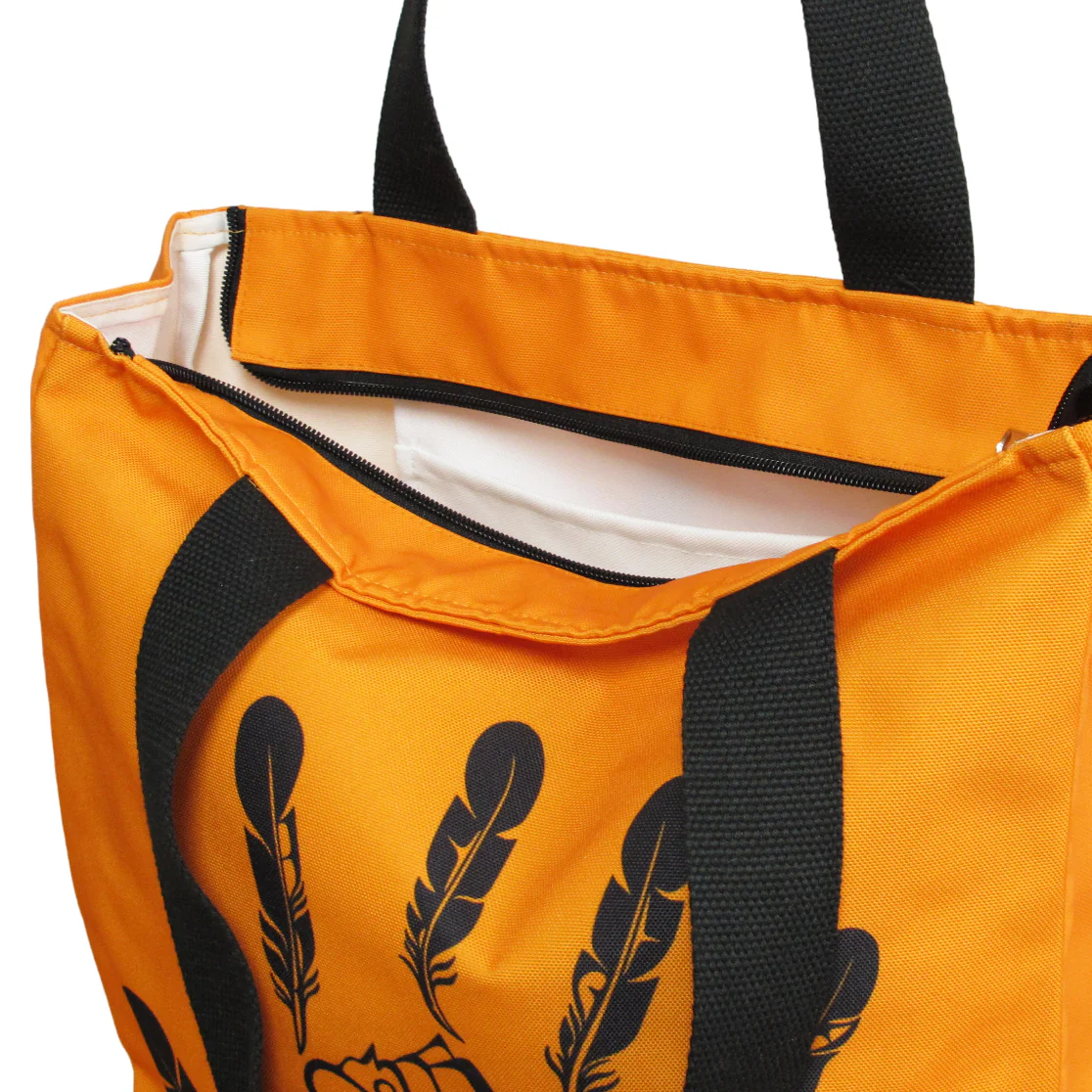 Sturdy, spacious, and vivd in colour, this eco-friendly reusable tote keeps items safe with a zippered top, inside pocket, and water resistant surface. The Gitxsan handprint features prominently on both sides.